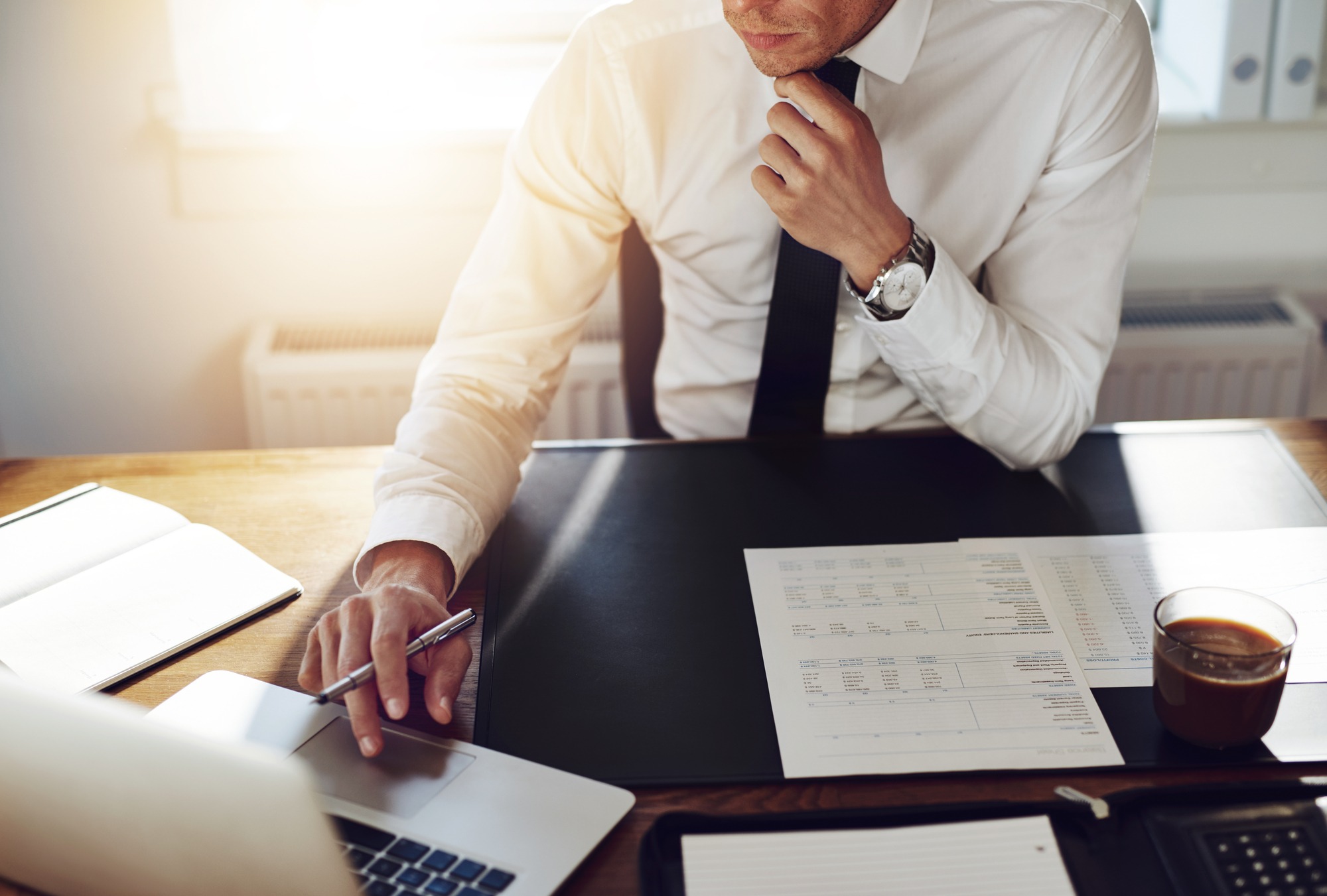Business man working at office with laptop